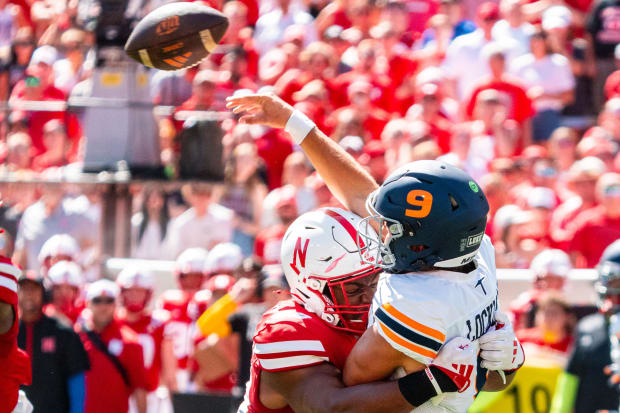 UTEP Miners quarterback Skyler Locklear (9) throws as he is hit by Nebraska Cornhuskers linebacker MJ Sherman (48).