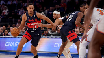 Nov 18, 2024; New York, New York, USA; Washington Wizards guard Malcolm Brogdon (15) controls the ball against New York Knicks guard Josh Hart (3) during the first quarter at Madison Square Garden. Mandatory Credit: Brad Penner-Imagn Images