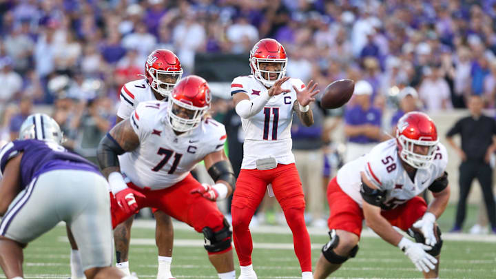Sep 13, 2024; Manhattan, Kansas, USA; Arizona Wildcats quarterback Noah Fifita (11) takes the snap during the first quarter against the Kansas State Wildcats at Bill Snyder Family Football Stadium. Mandatory Credit: Scott Sewell-Imagn Images