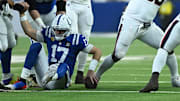 Nov 30, 2025; Indianapolis, Indiana, USA; Houston Texans defensive tackle Sheldon Rankins (90) and Houston Texans defensive end Will Anderson Jr. (51) celebrate after sacking Indianapolis Colts quarterback Daniel Jones (17) during the first half at Lucas Oil Stadium. Mandatory Credit: Robert Goddin-Imagn Images