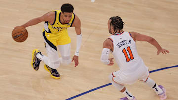 May 21, 2025; New York, New York, USA; Indiana Pacers guard Tyrese Haliburton (0) controls the ball against New York Knicks guard Jalen Brunson (11) in overtime during game one of the eastern conference finals for the 2025 NBA Playoffs at Madison Square Garden. Mandatory Credit: Brad Penner-Imagn Images