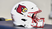 Nov 1, 2025; Blacksburg, Virginia, USA;  A Louisville Cardinals football helmet is seen before the game against the Virginia Tech Hokies at Lane Stadium. Mandatory Credit: Brian Bishop-Imagn Images