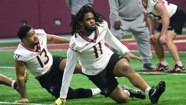 Florida State football players Sione Lolohea (13) and Patrick Payton (11) take part in the final Tour of Duty winter workouts ahead of 2024 spring practices on Thursday, March 7, 2024.