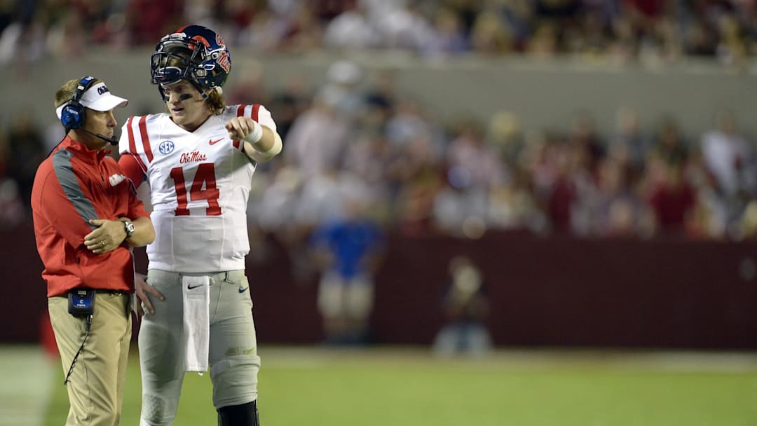 Sep 28, 2013; Tuscaloosa, AL, USA; Mississippi Rebels head coach Hugh Freeze talks with quarterback Bo Wallace (14) during a timeout against the Alabama Crimson Tide in the third quarter at Bryant-Denny Stadium. The Alabama Crimson Tide defeated the Mississippi Rebels 25-0. Mandatory Credit: John David Mercer-Imagn Images Sep 28, 2013; Tuscaloosa, AL, USA; Mississippi Rebels head coach Hugh Freeze talks with quarterback Bo Wallace (14) during a timeout against the Alabama Crimson Tide in the third quarter at Bryant-Denny Stadium. The Alabama Crimson Tide defeated the Mississippi Rebels 25-0. Mandatory Credit: John David Mercer-Imagn Images