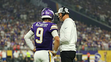 Sep 14, 2025; Minneapolis, Minnesota, USA; Minnesota Vikings quarterback J.J. McCarthy (9) speaks with Minnesota Vikings head coach Kevin O'Connell during the first half against the Atlanta Falcons at U.S. Bank Stadium. Mandatory Credit: Matt Krohn-Imagn Images