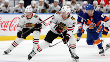 Dec 12, 2024; Elmont, New York, USA; Chicago Blackhawks left wing Taylor Hall (71) brings the puck up ice against New York Islanders right wing Oliver Wahlstrom (26) during the first period at UBS Arena. Mandatory Credit: Brad Penner-Imagn Images