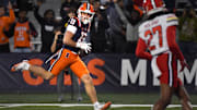 Nov 15, 2025; Champaign, Illinois, USA; Illinois Fighting Illini wide receiver Hudson Clement (13) scores a touchdown on a catch and run during the second half against the Illinois Fighting Illini at Memorial Stadium. Mandatory Credit: Ron Johnson-Imagn Images