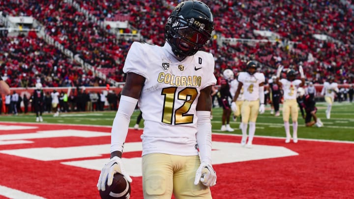 Nov 25, 2023; Salt Lake City, Utah, USA; Colorado Buffaloes athlete Travis Hunter (12) reacts after scoring a touchdown against the Utah Utes at Rice-Eccles Stadium.