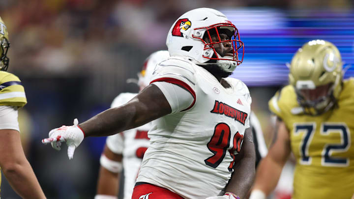 Sep 1, 2023; Atlanta, Georgia, USA; Louisville Cardinals defensive lineman Dezmond Tell (99) reacts against the Georgia Tech Yellow Jackets in the second half at Mercedes-Benz Stadium. Mandatory Credit: Brett Davis-Imagn Images Sep 1, 2023; Atlanta, Georgia, USA; Louisville Cardinals defensive lineman Dezmond Tell (99) reacts against the Georgia Tech Yellow Jackets in the second half at Mercedes-Benz Stadium. Mandatory Credit: Brett Davis-Imagn Images