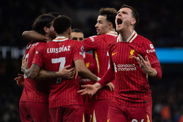 Liverpool celebrate scoring against Manchester City.