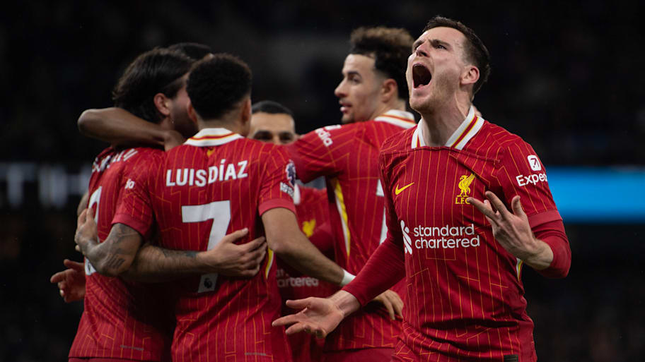 Liverpool celebrate scoring against Manchester City.