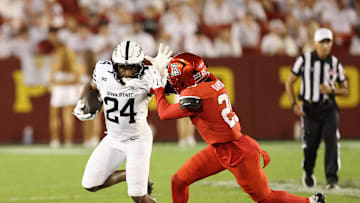 Sep 27, 2025; Ames, Iowa, USA; Iowa State Cyclones running back Abu Sama III (24) stiff arms Arizona Wildcats defensive back Michael Dansby (25) during the second half at Jack Trice Stadium. Mandatory Credit: Reese Strickland-Imagn Images