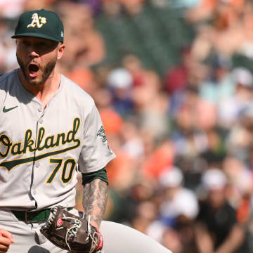 Apr 28, 2024; Baltimore, Maryland, USA;  Oakland Athletics relief pitcher Lucas Erceg (70) reacts to a strikeout to end the game during the ninth inning against the Oakland Athletics at Oriole Park at Camden Yards. Mandatory Credit: James A. Pittman-USA TODAY Sports