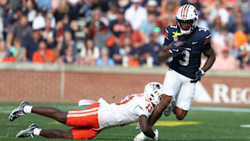 Nov 22, 2025; Auburn, Alabama, USA;  Auburn Tigers wide receiver Perry Thompson (3) is tackled by Mercer Bears safety Juwan Johnson (13) during the second quarter at Jordan-Hare Stadium. Mandatory Credit: John Reed-Imagn Images