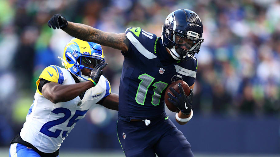 Seattle  (11) runs against Los Angeles Rams cornerback Roger McCreary