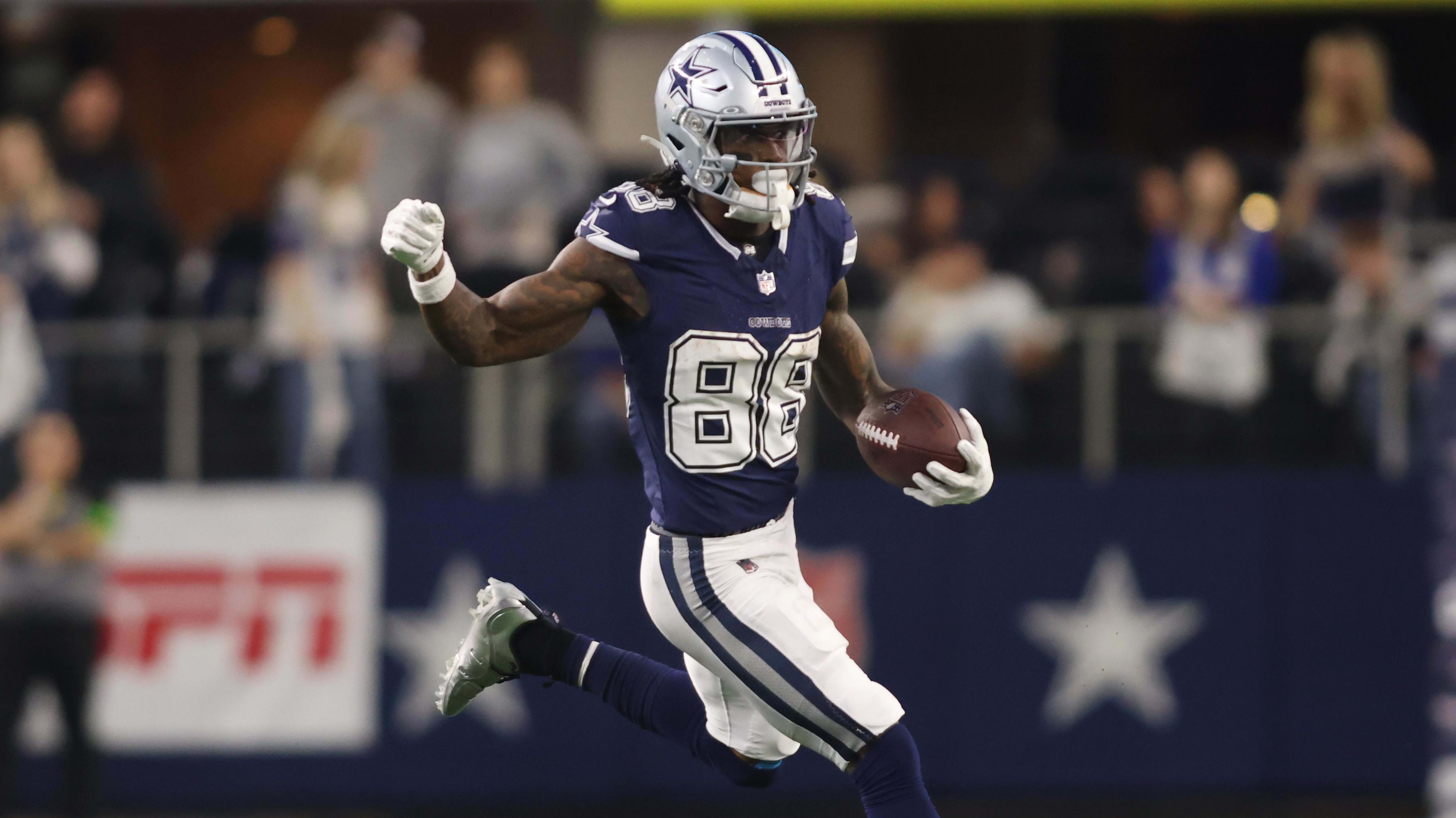 Dallas Cowboys wide receiver CeeDee Lamb runs the ball in.