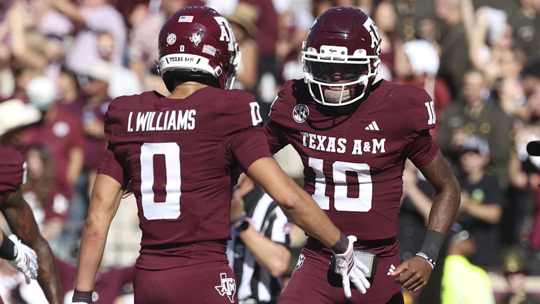 Texas A&M Aggies quarterback Marcel Reed celebrates with wide receiver Izaiah Williams after an Aggies touchdown during the third quarter against the South Carolina Gamecocks at Kyle Field.