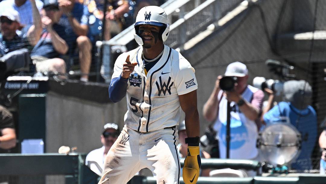Jun 12, 2026; Omaha, NE, USA; West Virginia Mountaineers right fielder Armani Guzman (5) reacts after stealing home against the Troy Trojans during the first inning at Charles Schwab Field. Mandatory Credit: Steven Branscombe-Imagn Images Jun 12, 2026; Omaha, NE, USA; West Virginia Mountaineers right fielder Armani Guzman (5) reacts after stealing home against the Troy Trojans during the first inning at Charles Schwab Field. Mandatory Credit: Steven Branscombe-Imagn Images