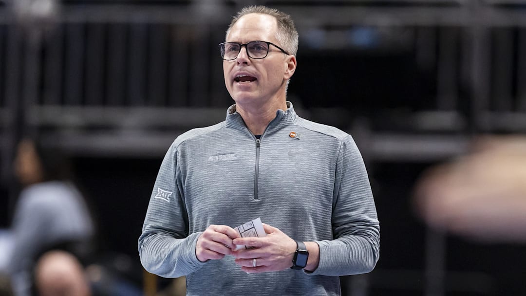 Mar 6, 2026; Kansas City, MO, USA; West Virginia head coach Mark Kellogg watches the run of play against Arizona State during the first half at T-Mobile Center. Mandatory Credit: Nick Tre. Smith-Imagn Images
