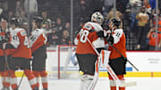 Oct 18, 2025; Philadelphia, Pennsylvania, USA; Philadelphia Flyers goaltender Dan Vladar (80) and right wing Travis Konecny (11) celebrate win in overtime against the Minnesota Wild at Wells Fargo Center. Mandatory Credit: Eric Hartline-Imagn Images