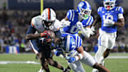 Nov 15, 2025; Durham, North Carolina, USA;  Virginia Cavaliers wide receiver Trell Harris (11) takes a hit from Duke Blue Devils saftey Ma'khi Jones (26) during the third quarter at Wallace Wade Stadium. Mandatory Credit: Zachary Taft-Imagn Images