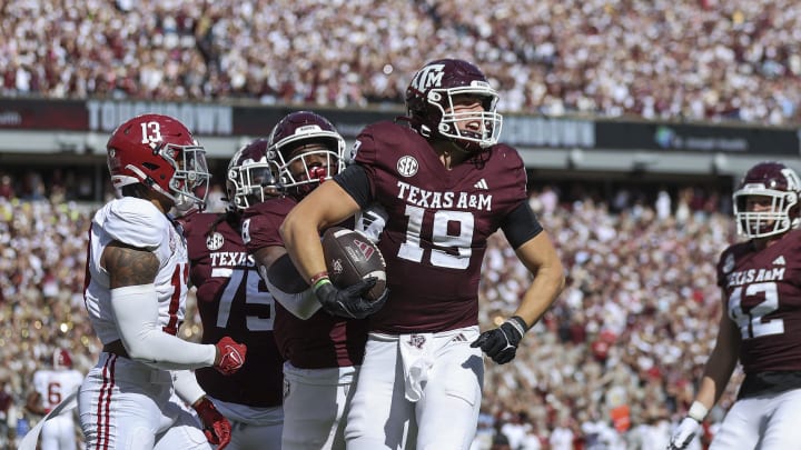 Oct 7, 2023; College Station, Texas, USA; Texas A&M Aggies tight end Jake Johnson (19) celebrates after scoring a touchdown during the second quarter against the Alabama Crimson Tide at Kyle Field. Mandatory Credit: Troy Taormina-USA TODAY Sports