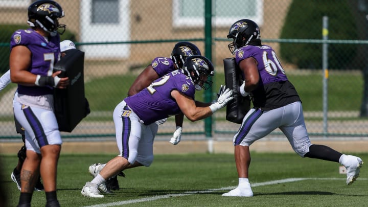 Baltimore Ravens offensive linemen Andrew Vorhees (72) and Ronnie Stanley (79) run through a drill during a joint practice with the Green Bay Packers on Thursday, August 22, 2024, at Ray Nitschke Field in Ashwaubenon, Wis. 
Tork Mason/USA TODAY NETWORK-Wisconsin