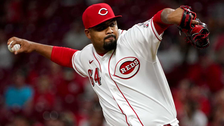 Cincinnati Reds starting pitcher Tony Santillan (64) delivers a pitch.