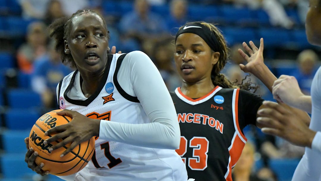 Mar 21, 2026; Los Angeles, CA, USA; Oklahoma State Cowboys forward Achol Akot (11) beats Princeton Tigers guard Madison St. Rose (23) to a rebound in the first half at Pauley Pavilion. Mandatory Credit: Jayne Kamin-Oncea-Imagn Images