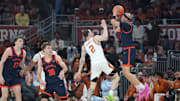 Dec 3, 2025; Austin, Texas, USA; Virginia Cavaliers guard Jacari White (6) shoots a three point basket against Texas Longhorns guard Chendall Weaver (2) during the first half at Moody Center. Mandatory Credit: Dustin Safranek-Imagn Images