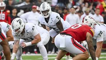 Sep 7, 2024; College Park, Maryland, USA; Michigan State Spartans quarterback Aidan Chiles (2) calls a p[lay at the line during the first quarter against the Maryland Terrapins  at SECU Stadium. Mandatory Credit: Tommy Gilligan-Imagn Images