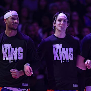 Jan 15, 2024; New York, New York, USA; New York Knicks guard Josh Hart (3), guard Ryan Arcidiacono (51), and guard Donte DiVincenzo (0) stand for the national anthem while wearing shirts honoring Martin Luther King Jr. before the game against the Orlando Magic at Madison Square Garden. Mandatory Credit: Vincent Carchietta-Imagn Images