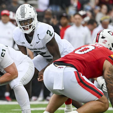 Sep 7, 2024; College Park, Maryland, USA; Michigan State Spartans quarterback Aidan Chiles (2) calls a p[lay at the line during the first quarter against the Maryland Terrapins  at SECU Stadium. Mandatory Credit: Tommy Gilligan-Imagn Images