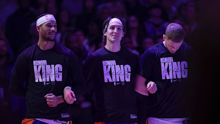 Jan 15, 2024; New York, New York, USA; New York Knicks guard Josh Hart (3), guard Ryan Arcidiacono (51), and guard Donte DiVincenzo (0) stand for the national anthem while wearing shirts honoring Martin Luther King Jr. before the game against the Orlando Magic at Madison Square Garden. Mandatory Credit: Vincent Carchietta-Imagn Images