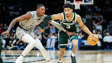 Michigan State guard Jaden Akins (3) dribbles against Mississippi State guard Shawn Jones Jr. (5) during the first half of NCAA tournament West Region first round at Spectrum Center in Charlotte, N.C. on Thursday, March 21, 2024.