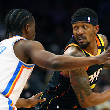 Apr 9, 2025; Phoenix, Arizona, USA; Phoenix Suns guard Bradley Beal (3) looks to dribble against Oklahoma City Thunder forward Adam Flagler (14) during the first half at Footprint Center. Mandatory Credit: Mark J. Rebilas-Imagn Images