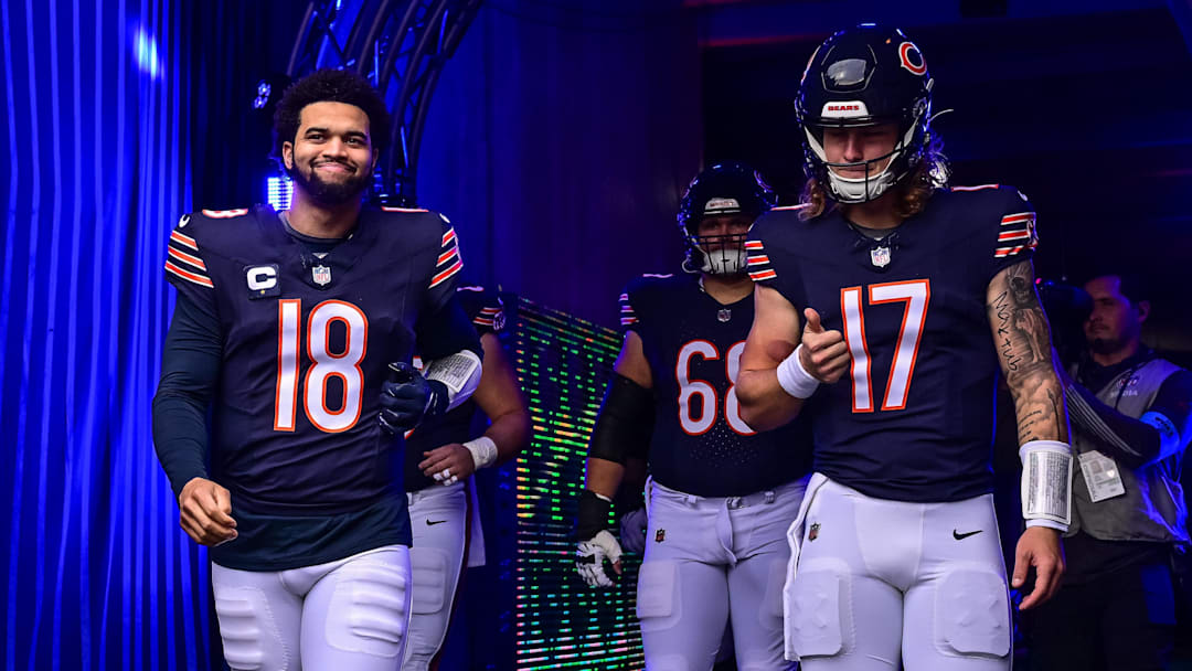 Chicago Bears quarterback Caleb Williams (18) and quarterback Tyson Bagent (17) enter the field before the game against the Green Bay Packers at Soldier Field.