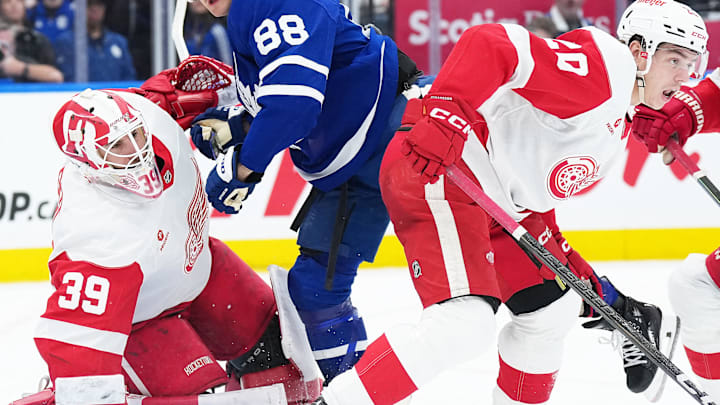 Apr 17, 2025; Toronto, Ontario, CAN; Toronto Maple Leafs right wing William Nylander (88) battles for the puck in front of Detroit Red Wings goaltender Cam Talbot (39) during the third period at Scotiabank Arena. Mandatory Credit: Nick Turchiaro-Imagn Images