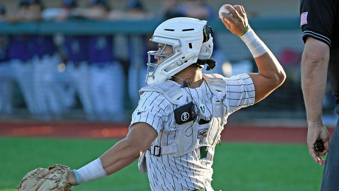 Venice's catcher Jon Embury wearing the one-way communication device during the game. Venice's catcher Jon Embury wearing the one-way communication device during the game.