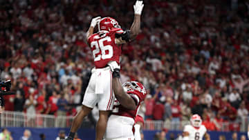 Dec 2, 2023; Atlanta, GA, USA; Alabama Crimson Tide running back Jam Miller (26) celebrates with tight end Amari Niblack (84) after scoring a touchdown in the second quarter against the Georgia Bulldogs at Mercedes-Benz Stadium. Mandatory Credit: Brett Davis-Imagn Images