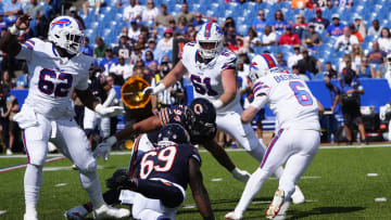 Aug 10, 2024; Orchard Park, New York, USA; Chicago Bears defensive end Austin Booker (94) tackles Buffalo Bills quarterback Shane Buechele (6) during the second half at Highmark Stadium. Mandatory Credit: Gregory Fisher-USA TODAY Sports