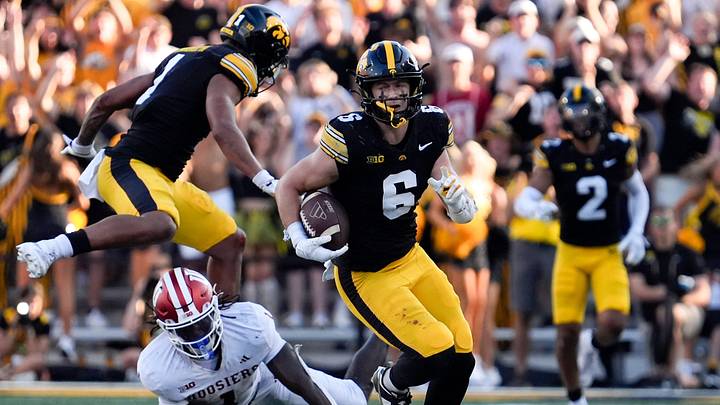 Iowa Hawkeyes defensive back Zach Lutmer (6) runs with the ball after intercepting a pass by Indiana Hoosiers quarterback Fernando Mendoza (15) Sept. 27, 2025 at Kinnick Stadium in Iowa City, Iowa.