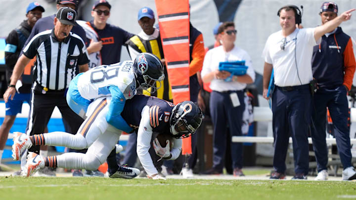 Tennessee Titans cornerback L'Jarius Sneed (38) tackles Chicago Bears wide receiver Keenan Allen (13) for a first down in the first quarter of their game at Soldier Field in Chicago, Ill., Sunday, Sept. 8, 2024.