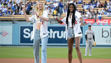 May 20, 2024; Los Angeles, California, USA; Los Angeles Sparks Cameron Brink (22) and Rickea Jackson (2) throw out the first pitch prior to the game between the Los Angeles Dodgers and the Arizona Diamondbacks at Dodger Stadium. Mandatory Credit: Jayne Kamin-Oncea-Imagn Images