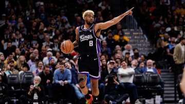 Feb 28, 2024; Denver, Colorado, USA; Sacramento Kings guard Mason Jones (8) gestures as he dribbles the ball up court in the fourth quarter against the Denver Nuggets at Ball Arena. Mandatory Credit: Isaiah J. Downing-USA TODAY Sports