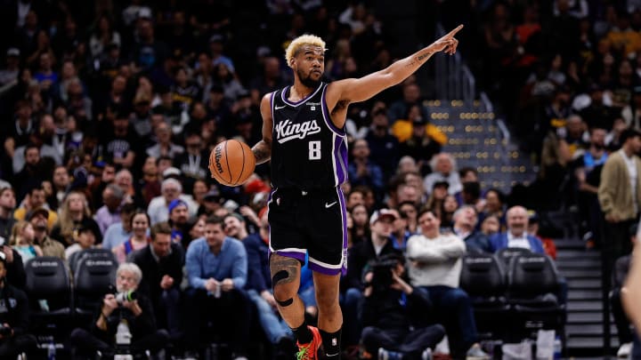 Feb 28, 2024; Denver, Colorado, USA; Sacramento Kings guard Mason Jones (8) gestures as he dribbles the ball up court in the fourth quarter against the Denver Nuggets at Ball Arena. Mandatory Credit: Isaiah J. Downing-USA TODAY Sports