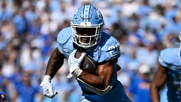 Oct 5, 2024; Chapel Hill, North Carolina, USA; North Carolina Tar Heels running back Omarion Hampton (28) runs in the second quarter at Kenan Memorial Stadium. Mandatory Credit: Bob Donnan-Imagn Images
