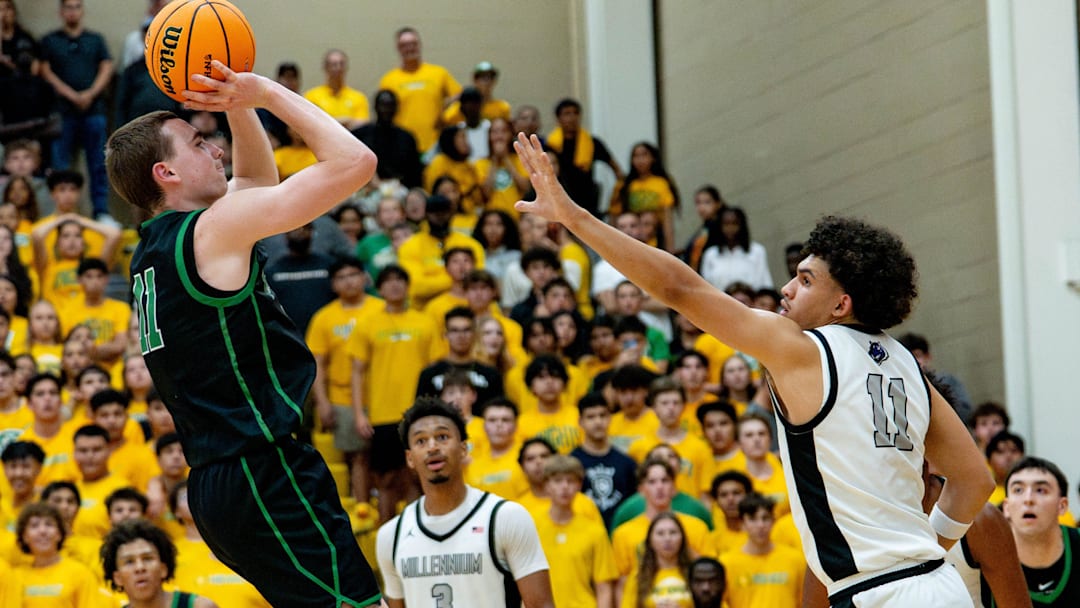 St. Mary's Knights Mick Riordan (11) shoots a jumper over Millennium Tigers DJ Spencer (11) during the open division semifinals at Chaparral High School in Scottsdale, on March 4, 2026.