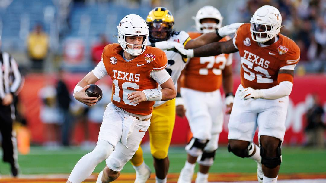 Texas quarterback Arch Manning (16) runs with the ball against Michigan at Camping World Stadium. Mandatory Credit: Matt Pendleton-Imagn Images