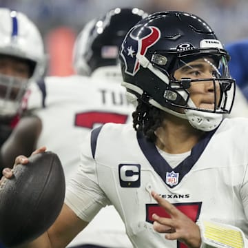 Jan 6, 2024; Indianapolis, Indiana, USA; Houston Texans quarterback C.J. Stroud (7) drops back to pass against the Indianapolis Colts at Lucas Oil Stadium. Mandatory Credit: Robert Scheer-Imagn Images